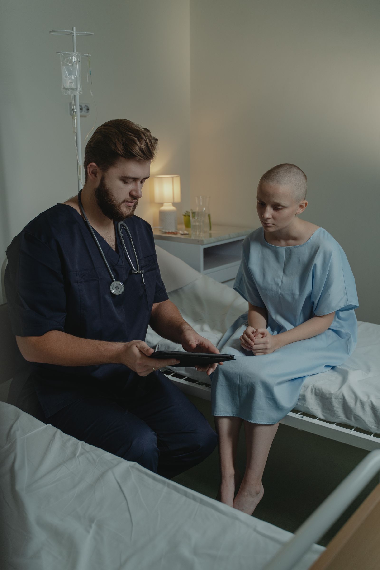 A nurse caring for a patient in a hospital room